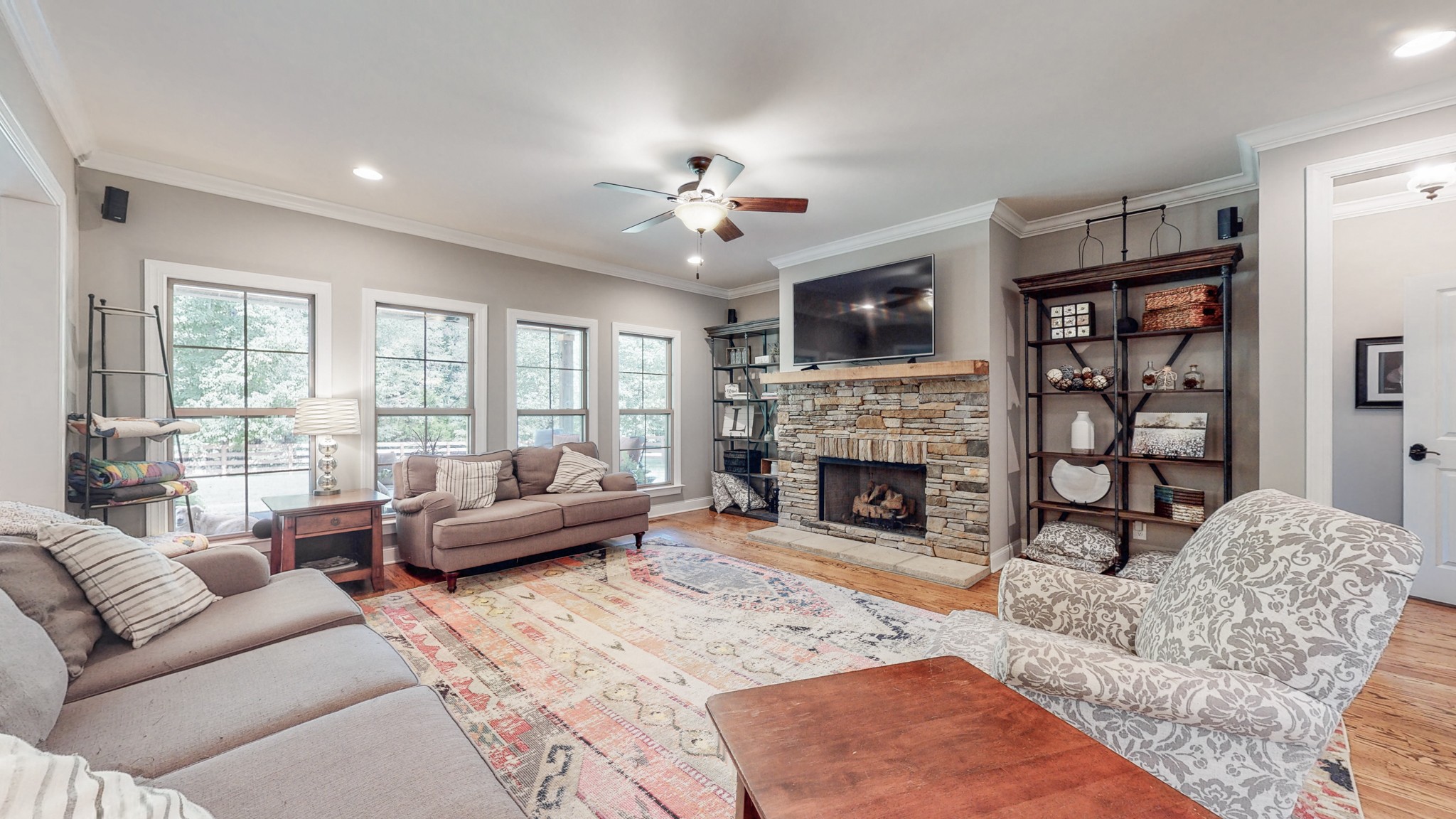7270 Old Franklin Road Fairview, TN 37062 - Photo 11 of 46 a living room with furniture a fireplace and a large window