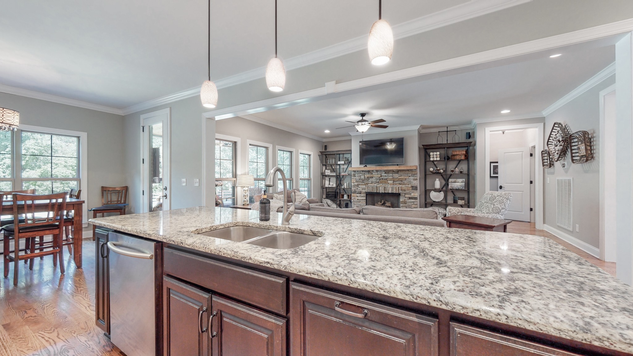 7270 Old Franklin Road Fairview, TN 37062 - Photo 13 of 46 a large kitchen with kitchen island a large counter space dining table and stainless steel appliances