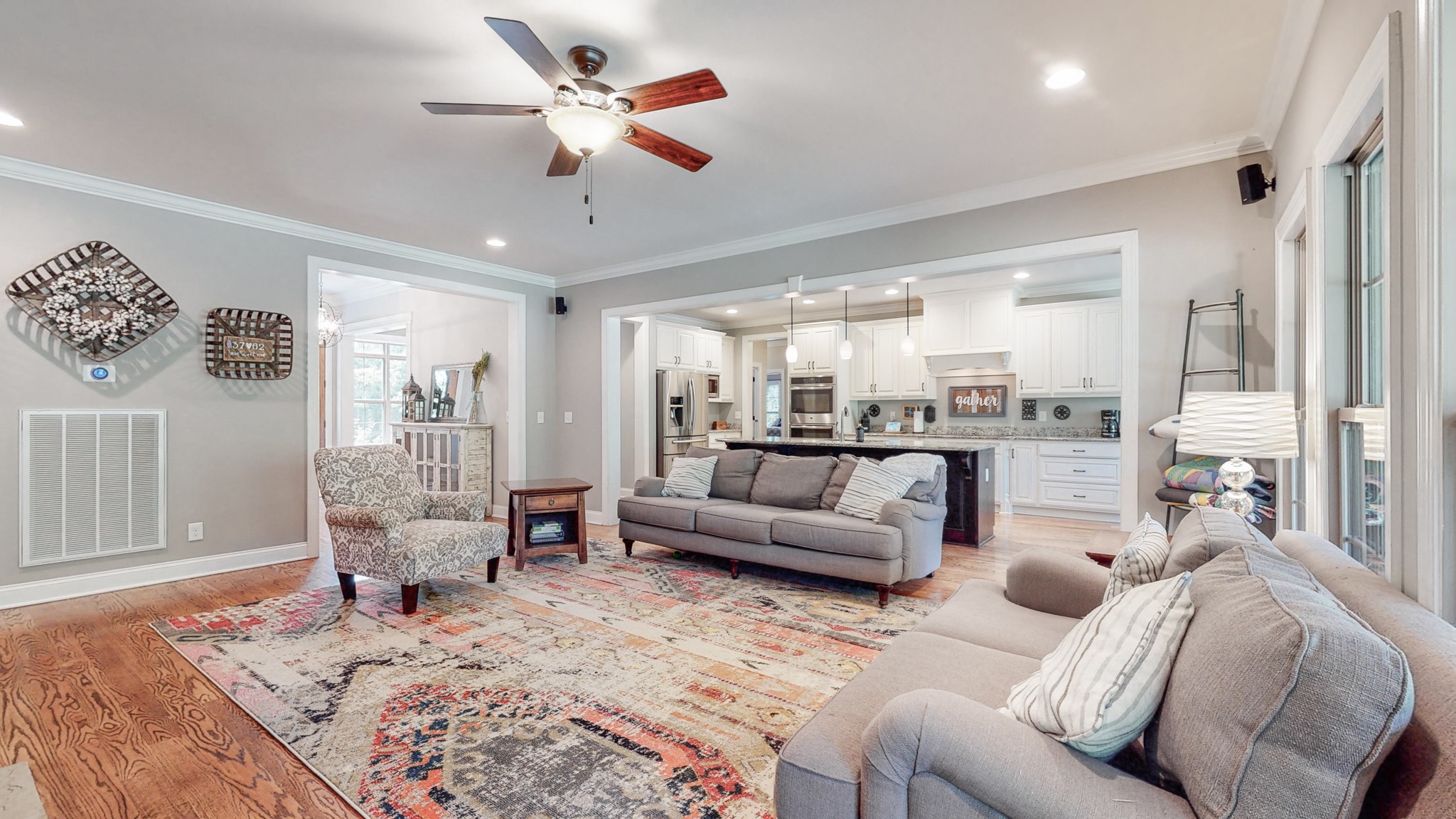 7270 Old Franklin Road Fairview, TN 37062 - Photo 17 of 46 a living room with furniture wooden floor and a chandelier
