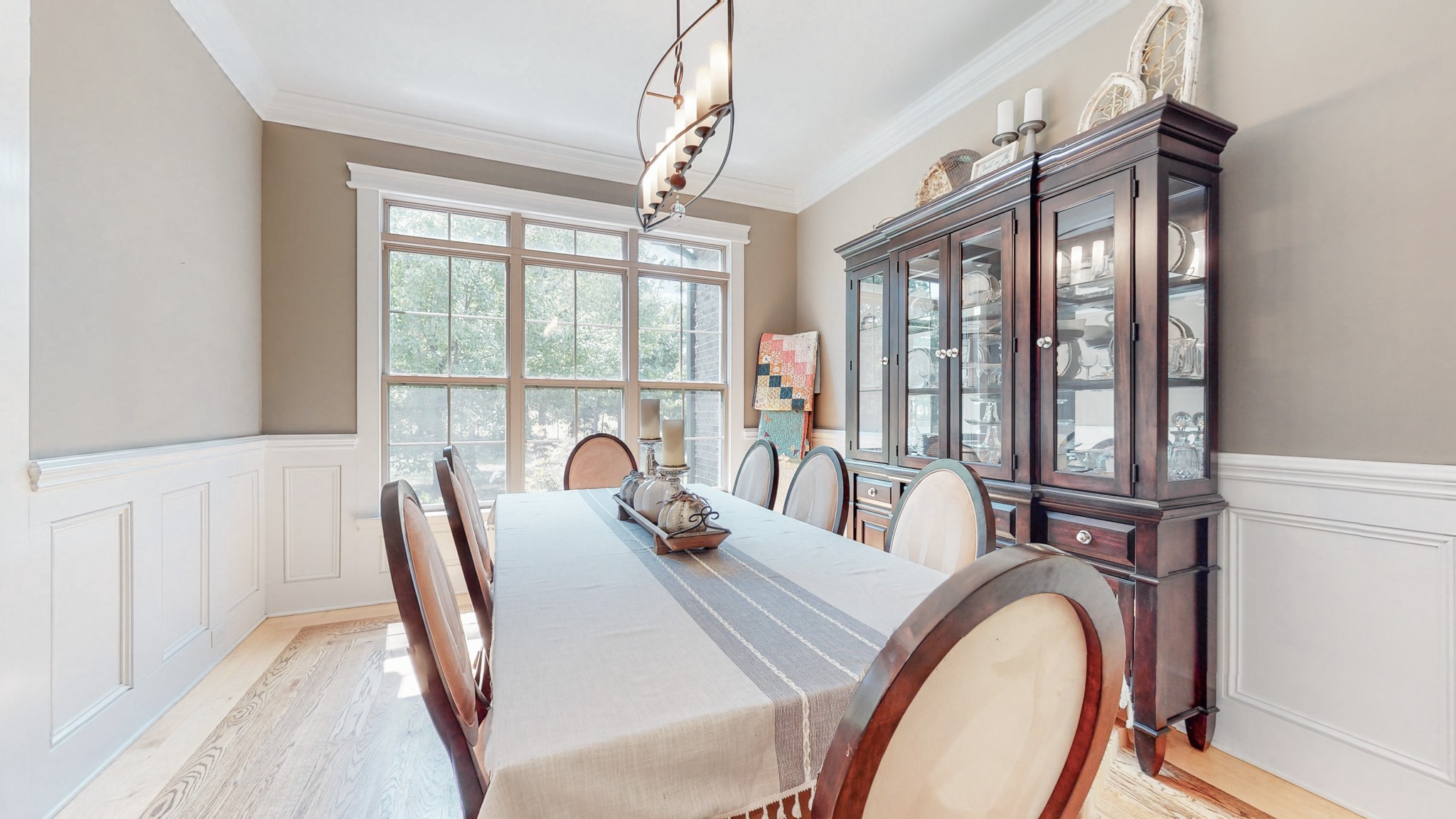 7270 Old Franklin Road Fairview, TN 37062 - Photo 20 of 46 a view of a dining room with furniture a chandelier and wooden floor
