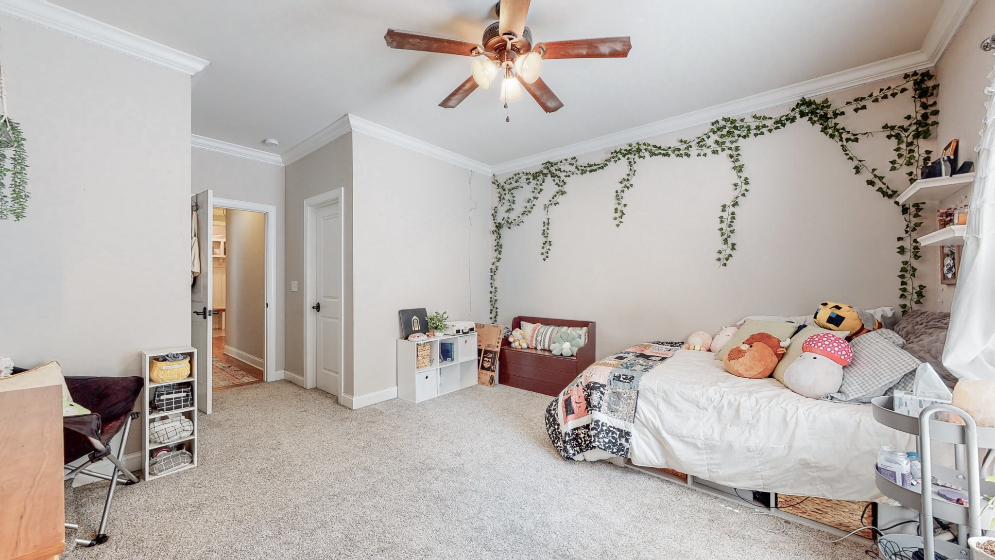 7270 Old Franklin Road Fairview, TN 37062 - Photo 36 of 46 a bedroom with a bed and a chandelier