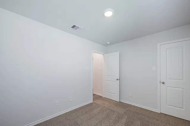 an empty room with an entryway