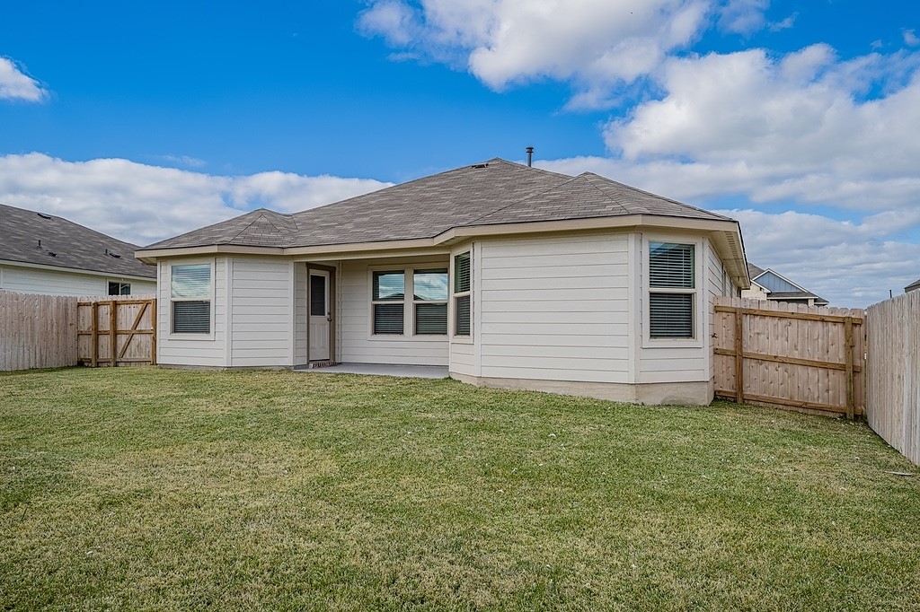 1101 Davy Street Brenham, TX 77833 - Photo 18 of 18 a house with yard in front of it