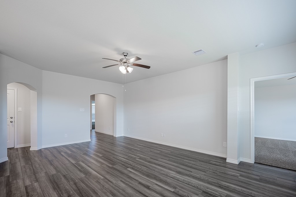 1101 Davy Street Brenham, TX 77833 - Photo 6 of 18 a view of an empty room with wooden floor