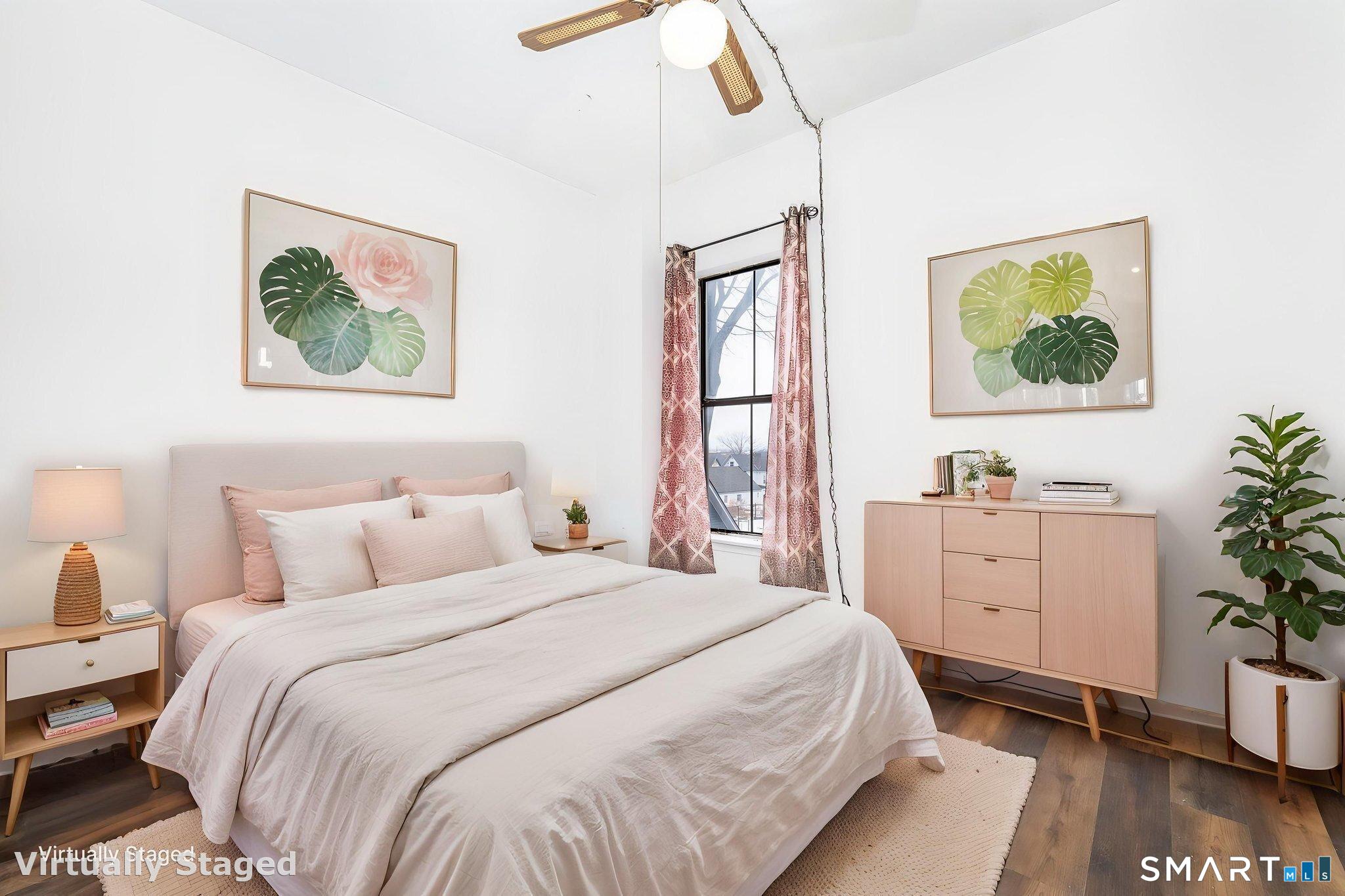36-38 Capen Street, Unit 2B Hartford, CT 06120 - Photo 12 of 25 a bedroom with a bed and a window