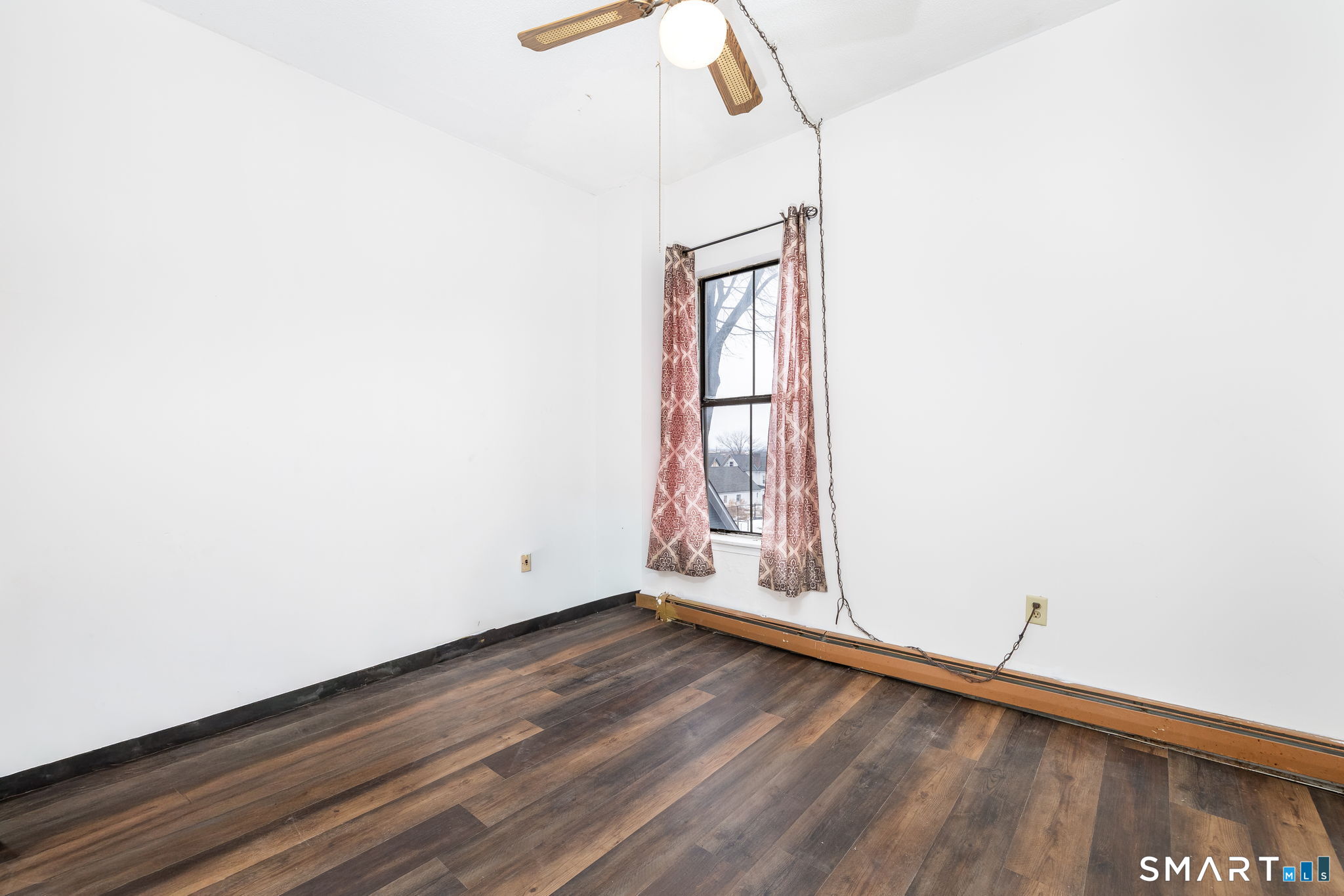 36-38 Capen Street, Unit 2B Hartford, CT 06120 - Photo 13 of 25 a view of an empty room with wooden floor and a window
