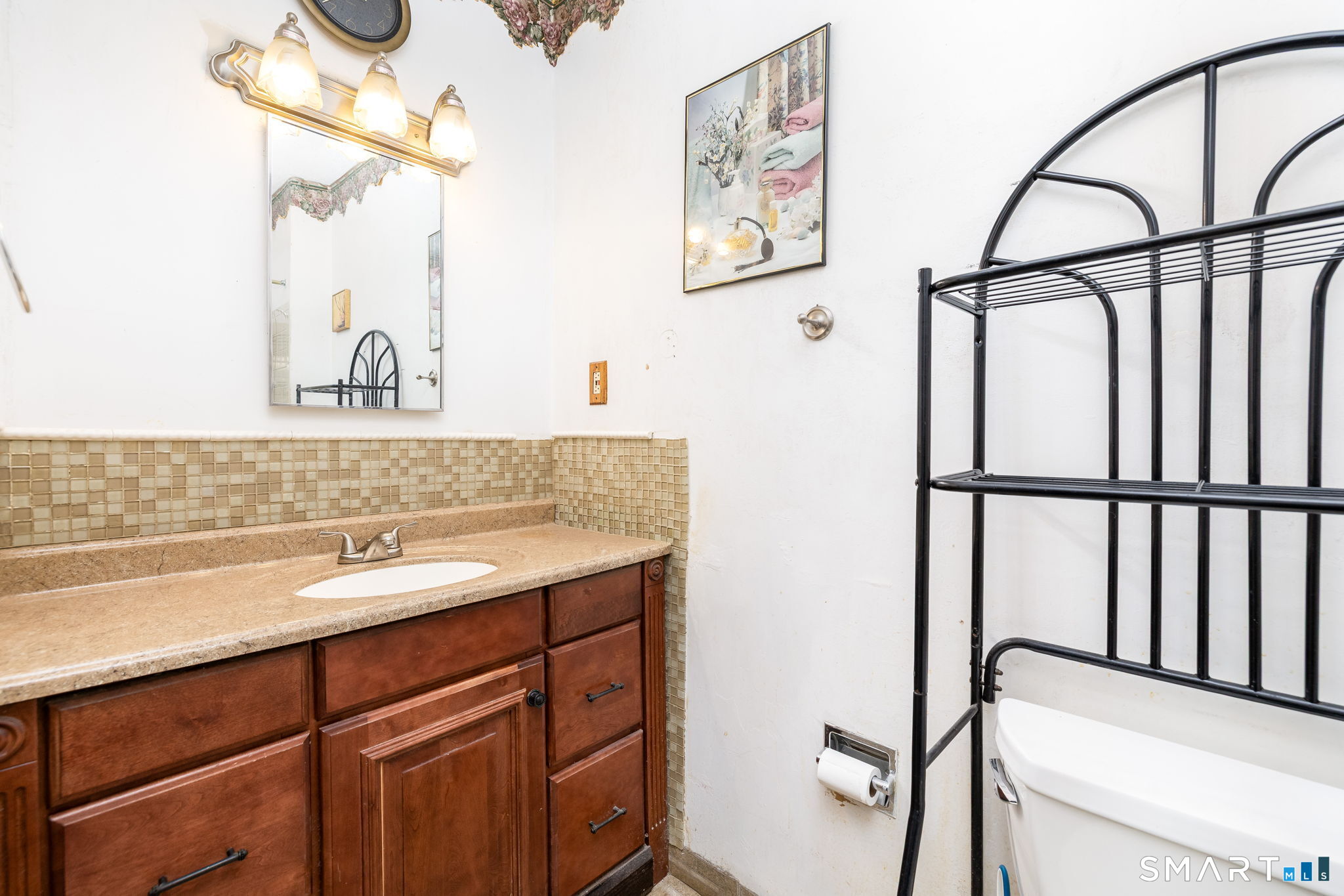 36-38 Capen Street, Unit 2B Hartford, CT 06120 - Photo 17 of 25 a bathroom with a sink and a mirror