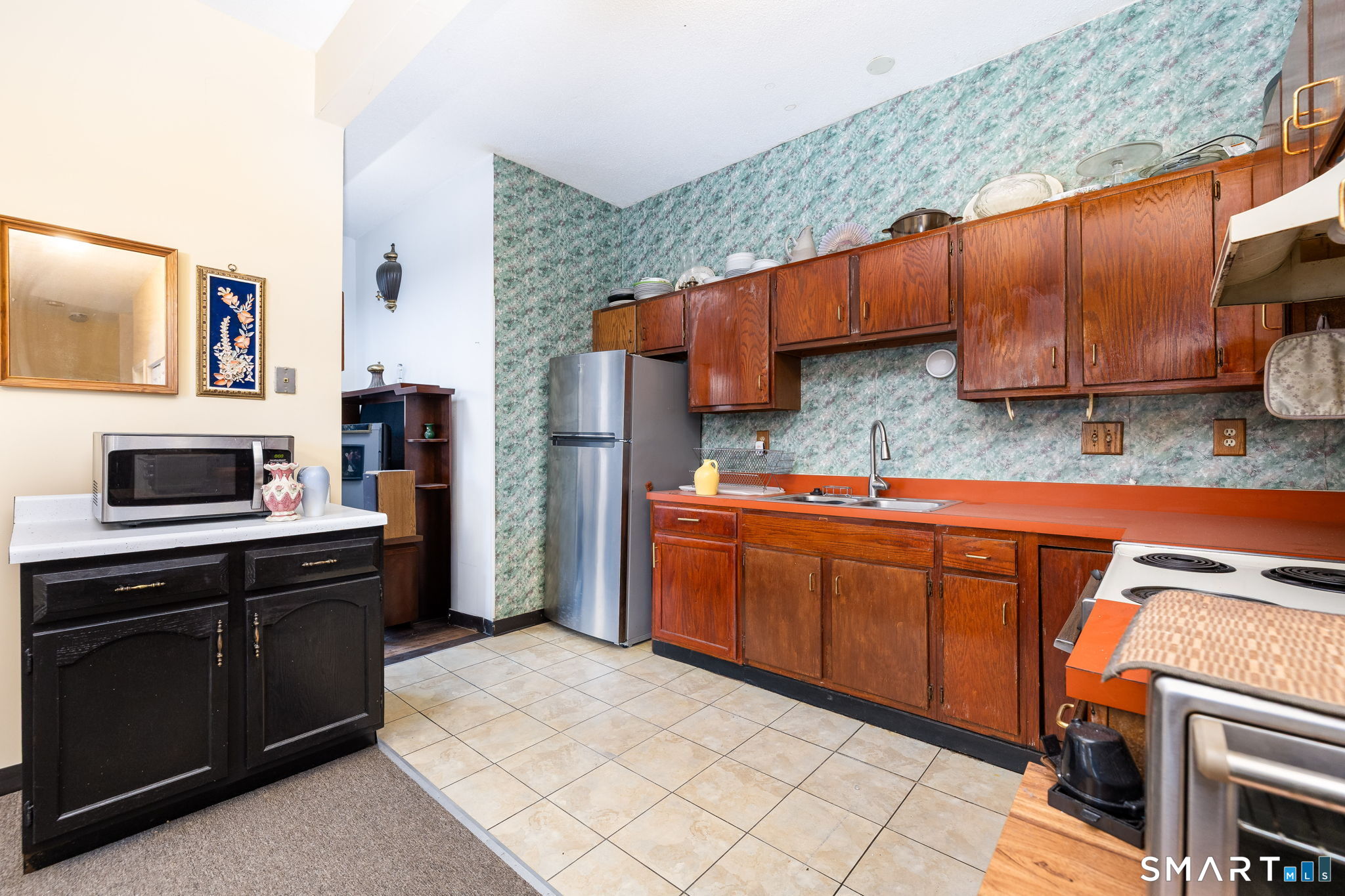 36-38 Capen Street, Unit 2B Hartford, CT 06120 - Photo 8 of 25 a kitchen with stainless steel appliances granite countertop a stove a sink and a microwave