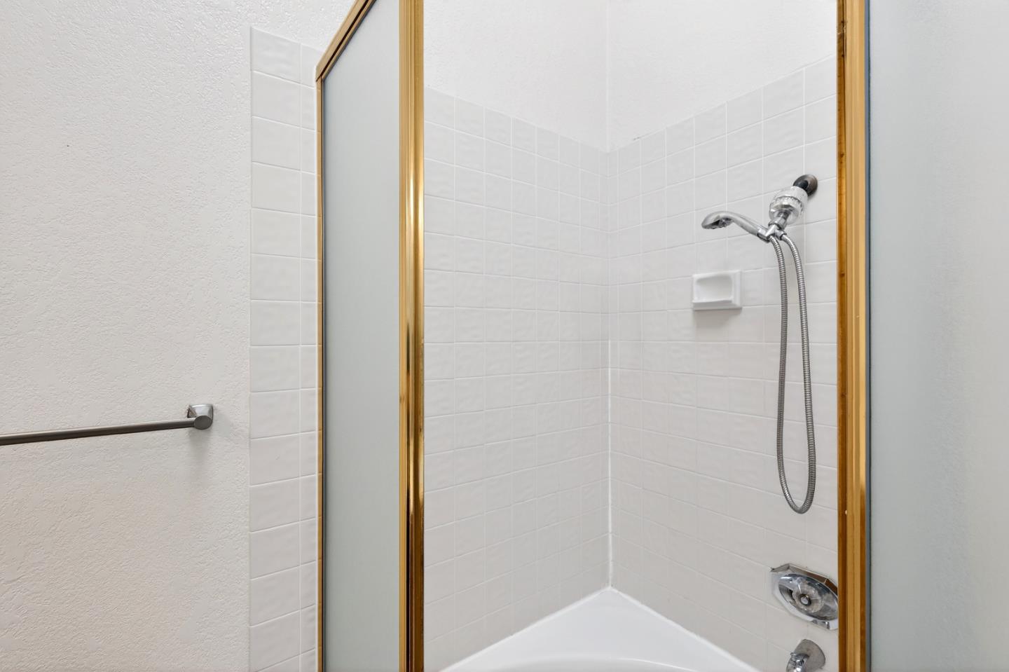 22330 Homestead Road, Unit 214 Cupertino, CA 95014 - Photo 23 of 35 a bathroom with a shower and a toilet