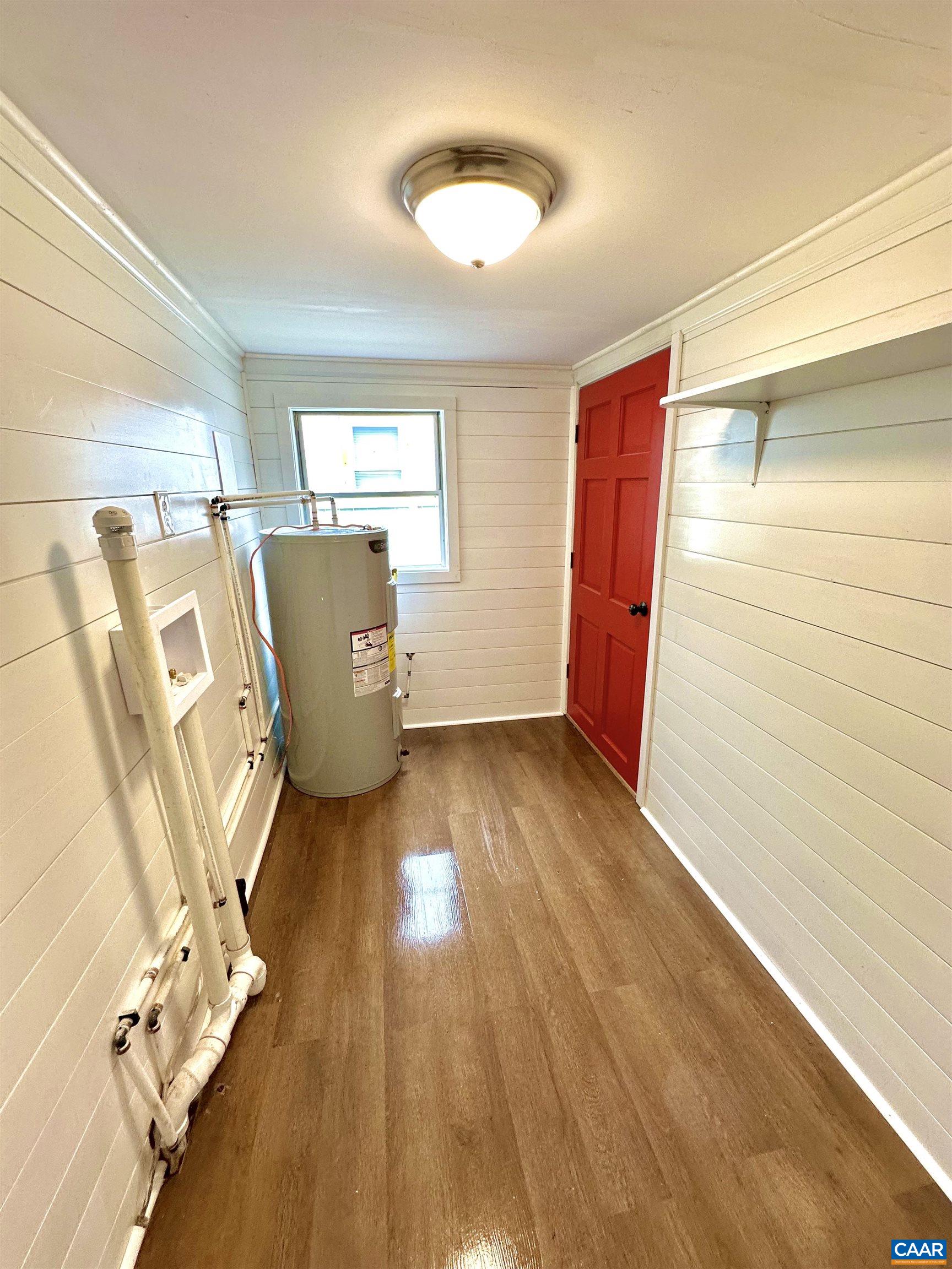 419 Quarry Road Charlottesville, VA 22902 - Photo 13 of 18 a view of a room with wooden floor and windows