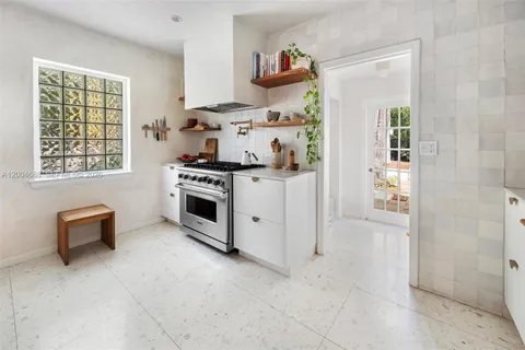 a kitchen with a stove and a refrigerator