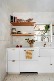 a white cabinet with a white wooden cabinets washer and cabinets