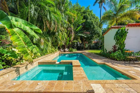 a view of yard with swimming pool