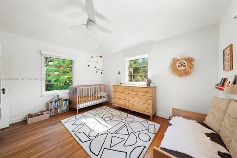 a bedroom with furniture and a window