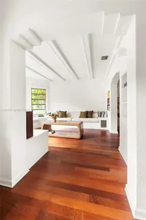 a view of living room with furniture and rug floor