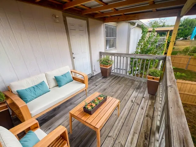 a view of a deck with furniture