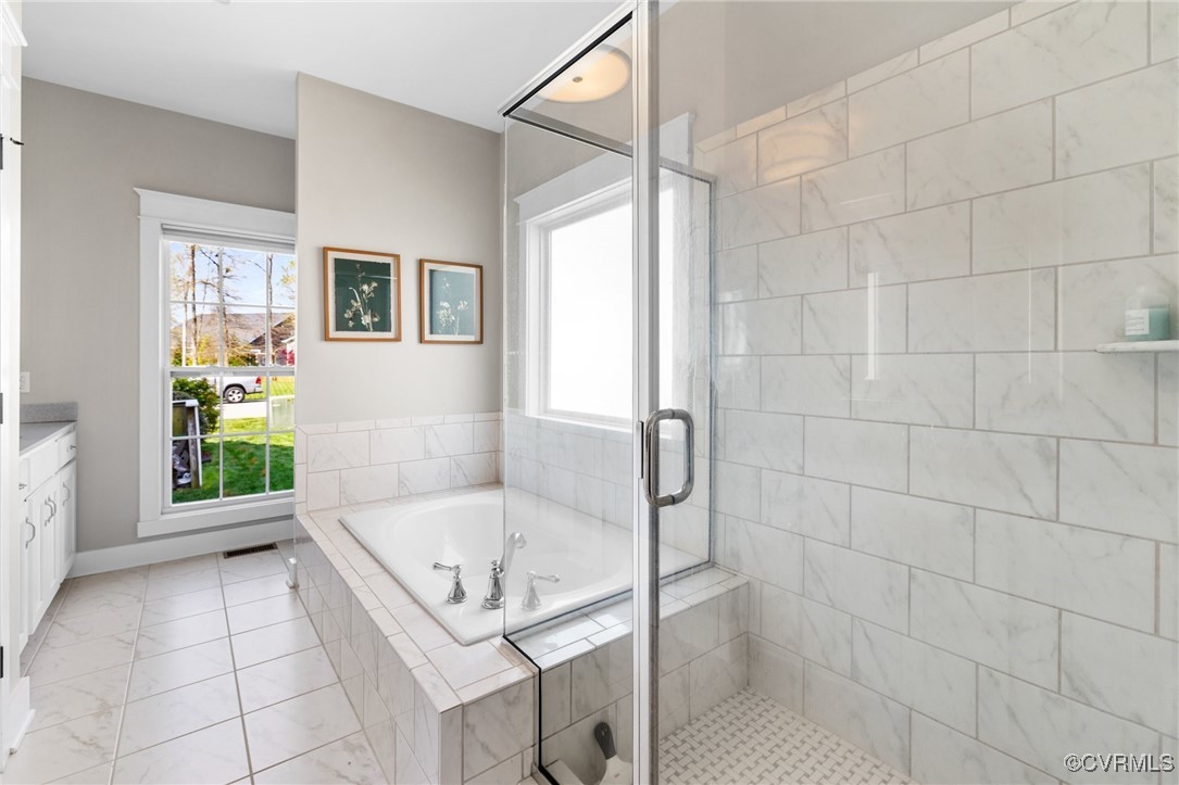 3919 Graythorne Drive Midlothian, VA 23112 - Photo 22 of 41 a bathroom with a tub a sink and a shower