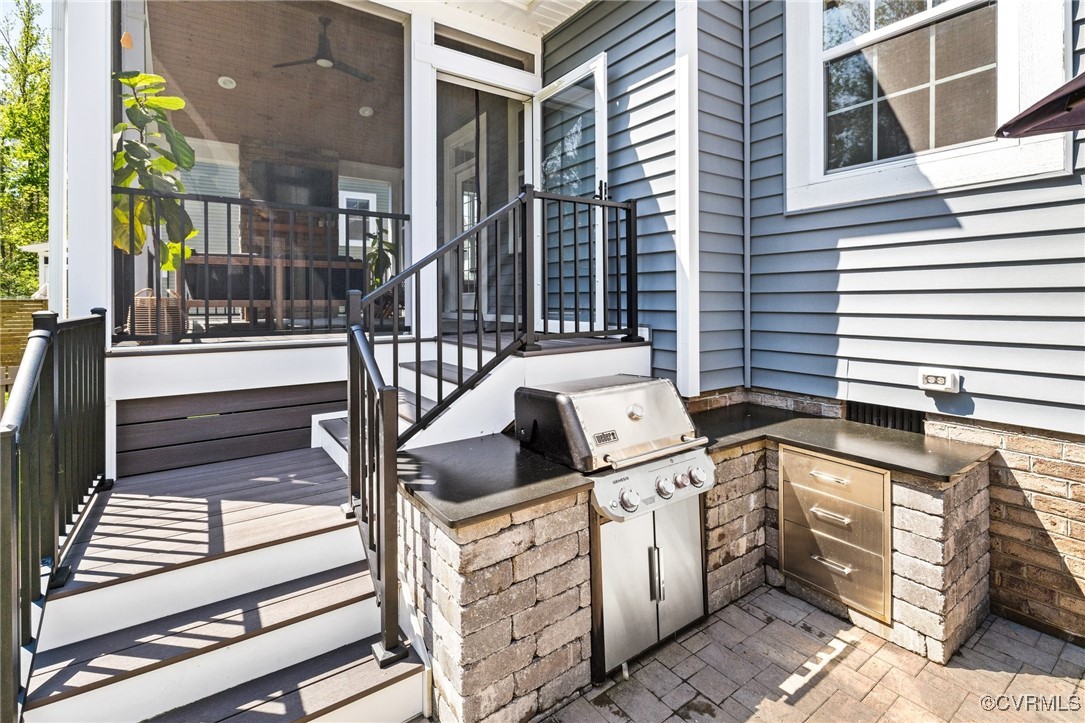 3919 Graythorne Drive Midlothian, VA 23112 - Photo 35 of 41 a view of a brick house with entryway and wooden fence