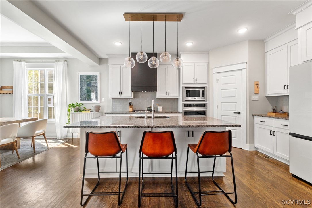 3919 Graythorne Drive Midlothian, VA 23112 - Photo 8 of 41 a kitchen with stainless steel appliances granite countertop a stove a sink and a refrigerator
