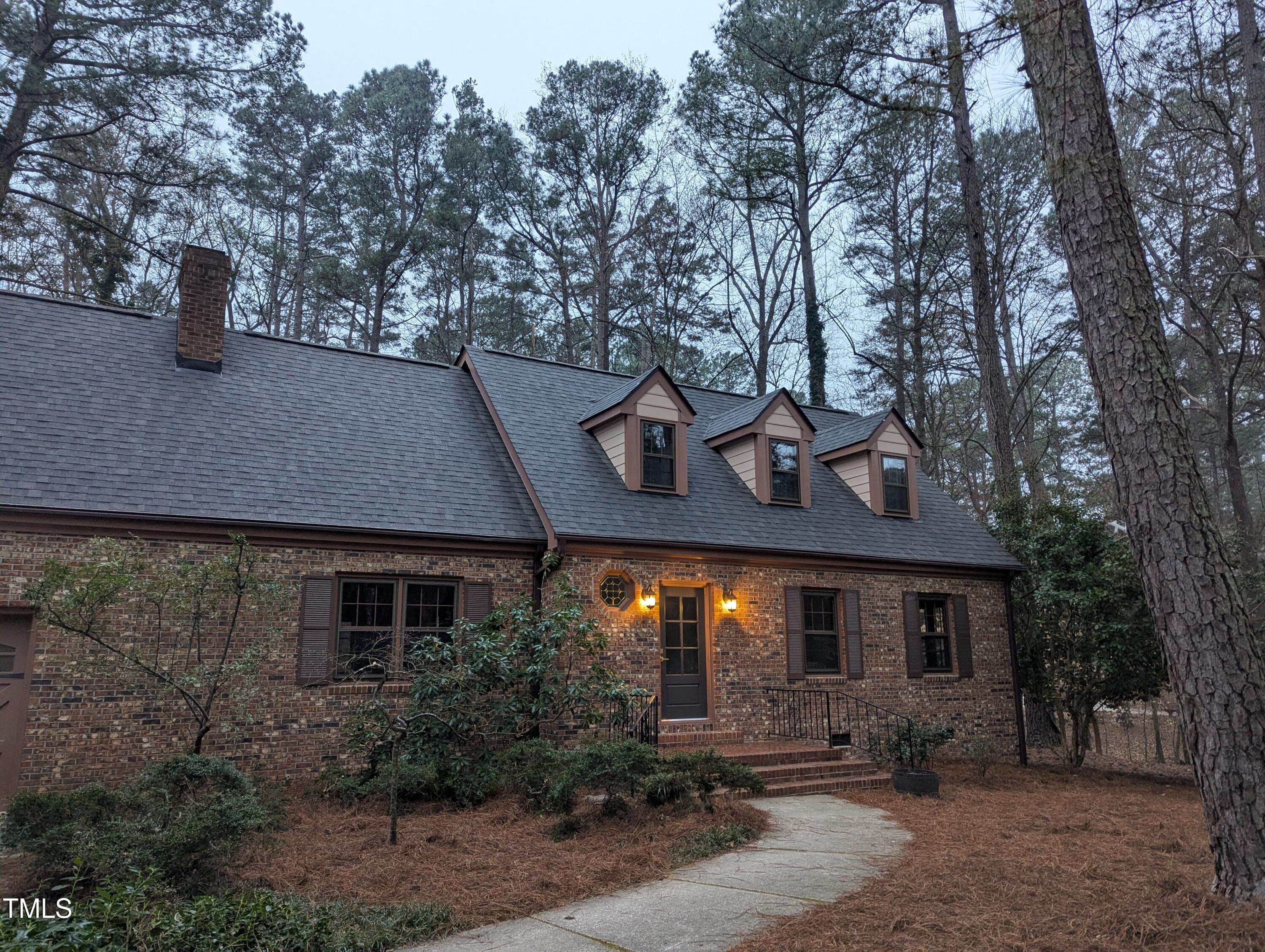11505 Hyde Place Raleigh, NC 27614 - Photo 1 of 1 a front view of a house with yard