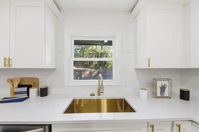 a kitchen with a sink and a window