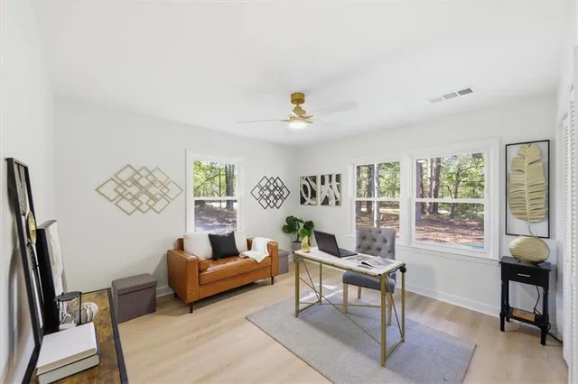 a living room with furniture and a window
