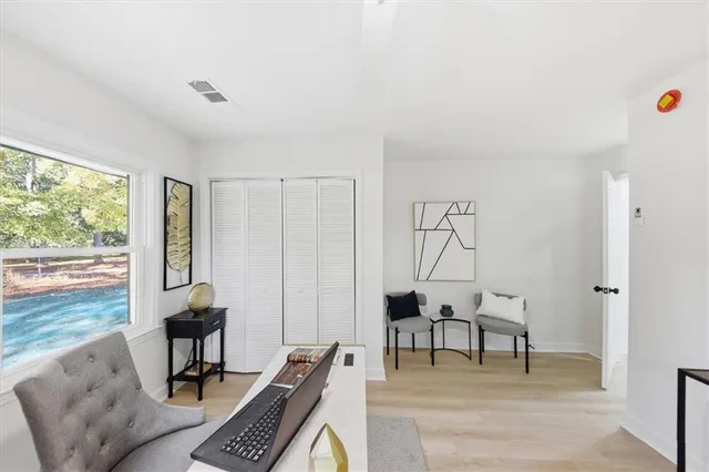 a living room with furniture and a window