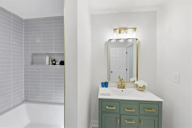 a bathroom with a sink and a mirror