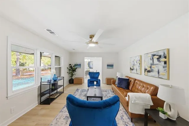 a living room with furniture and a large window