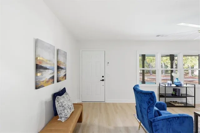 a living room with furniture and a window