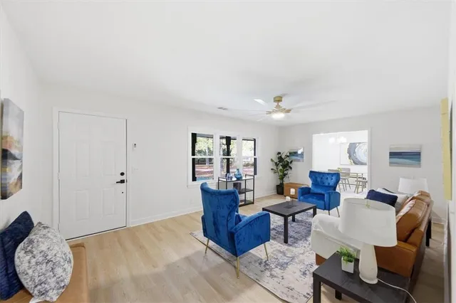 a living room with furniture and a large window