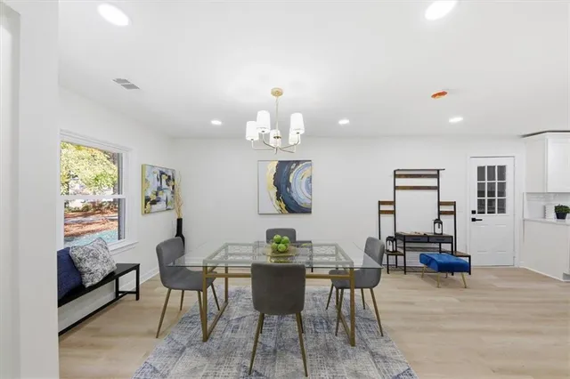 a dining room with furniture and window