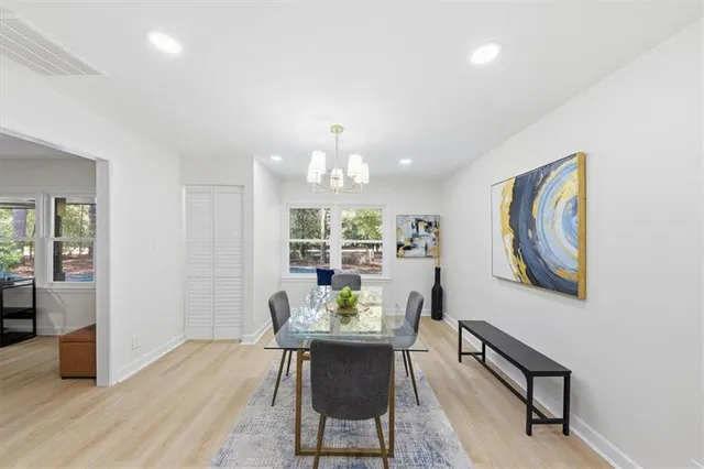 a view of a dining room with furniture window and wooden floor
