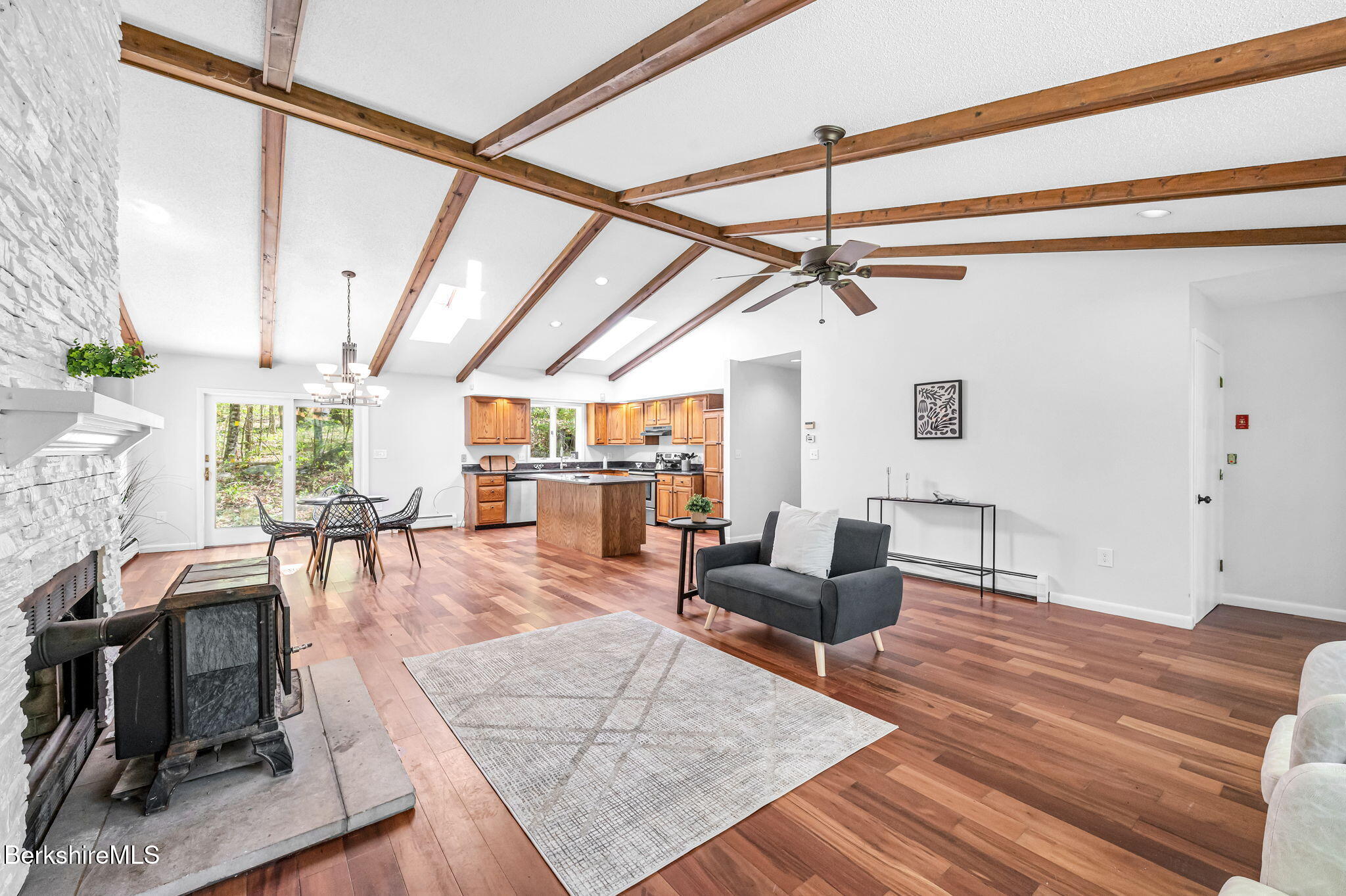 1874 Home Road Sheffield, MA 01230 - Photo 13 of 42 a living room with furniture and a floor to ceiling window