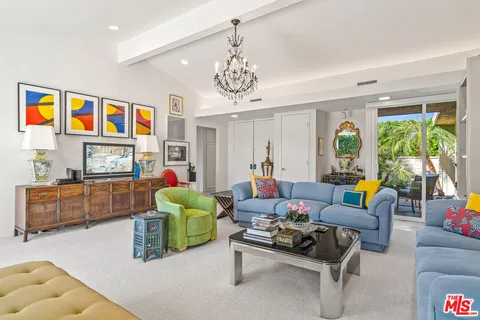 a kitchen with stainless steel appliances granite countertop a refrigerator a stove and a sink