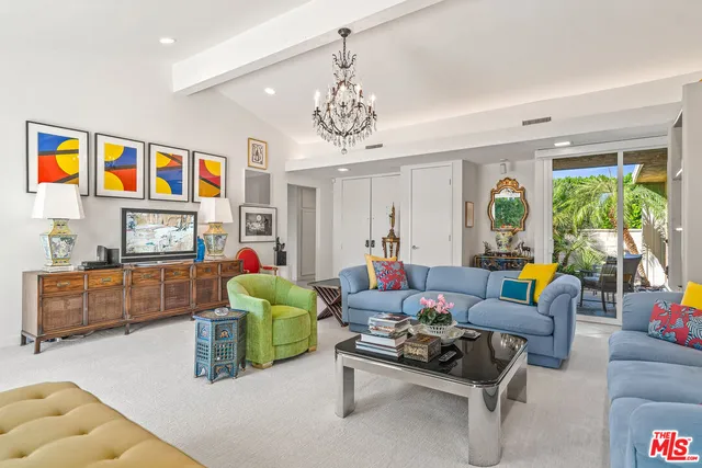 a kitchen with stainless steel appliances granite countertop a refrigerator a stove and a sink