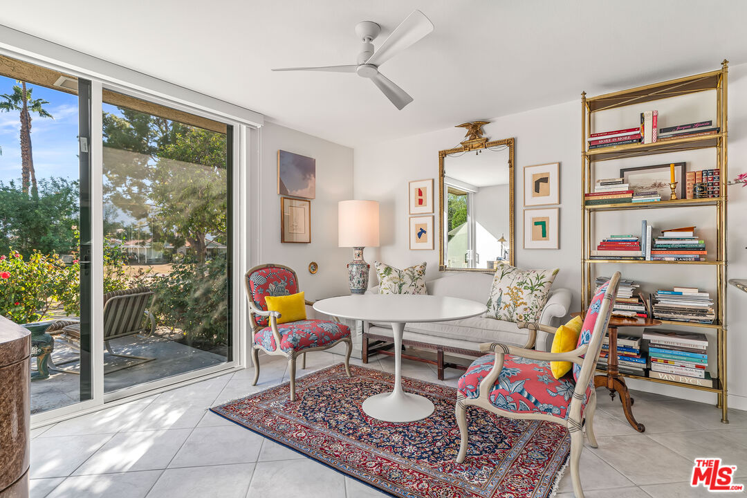 72325 Roxbury Drive Rancho Mirage, CA 92270 - Photo 13 of 66 a living room with furniture and a floor to ceiling window
