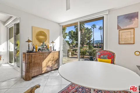 a kitchen with stainless steel appliances granite countertop a refrigerator sink and stove