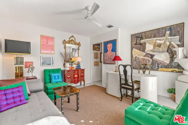 a bathroom with a sink vanity mirror and toilet