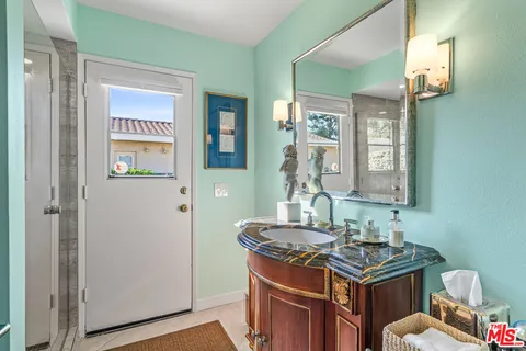 a bedroom with bed and window