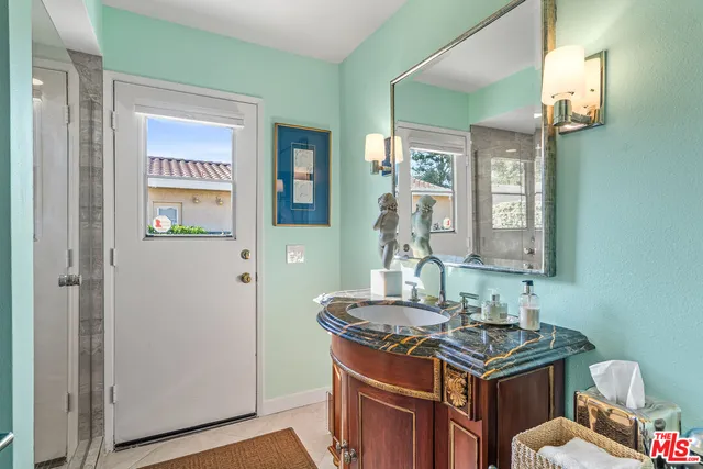 a bedroom with bed and window