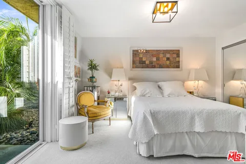 a view of living room filled with furniture and garden view