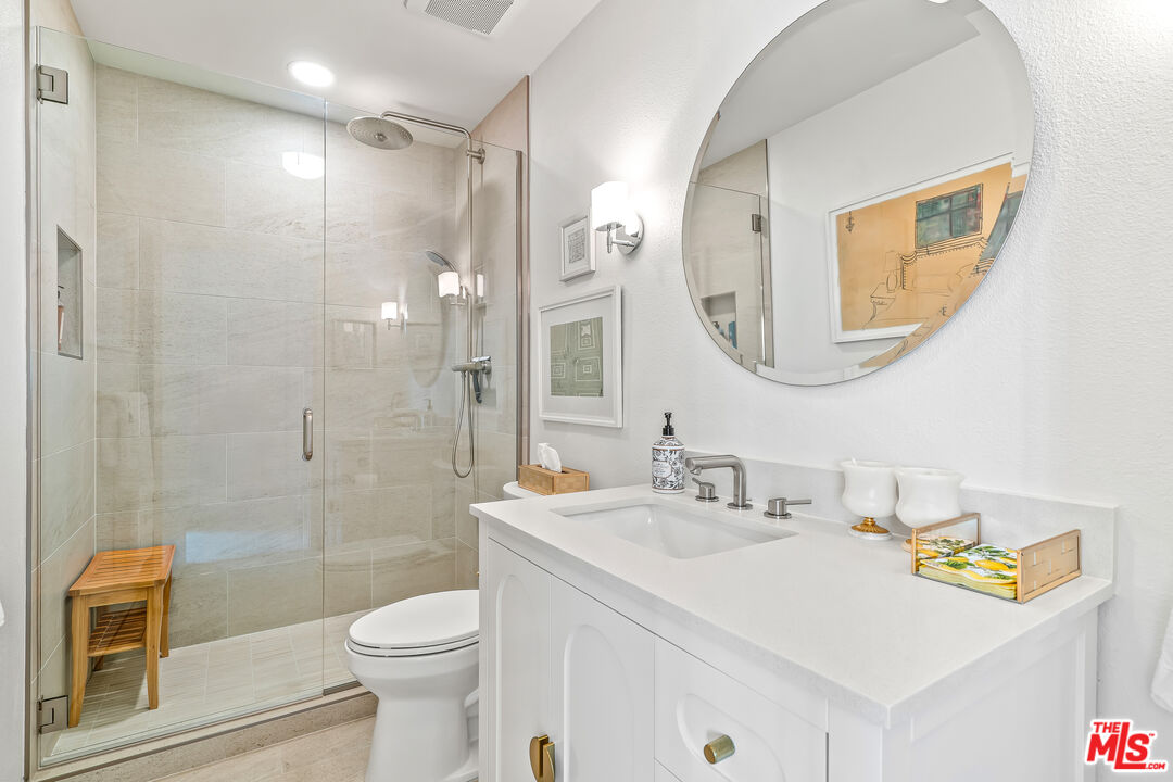 72325 Roxbury Drive Rancho Mirage, CA 92270 - Photo 26 of 66 a bathroom with a sink vanity mirror and toilet