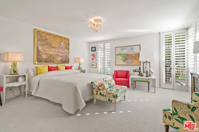 a bathroom with a double vanity sink mirror and shower