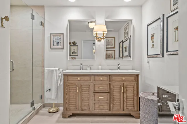 a front view of a house with a yard and potted plants