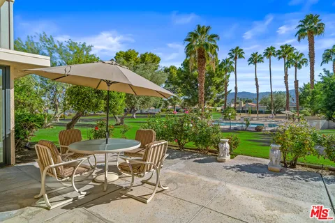 a view of a swimming pool with a lounge chairs