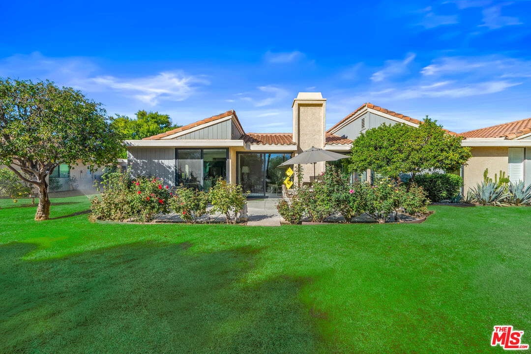 72325 Roxbury Drive Rancho Mirage, CA 92270 - Photo 40 of 66 a view of a chair and table of the garden
