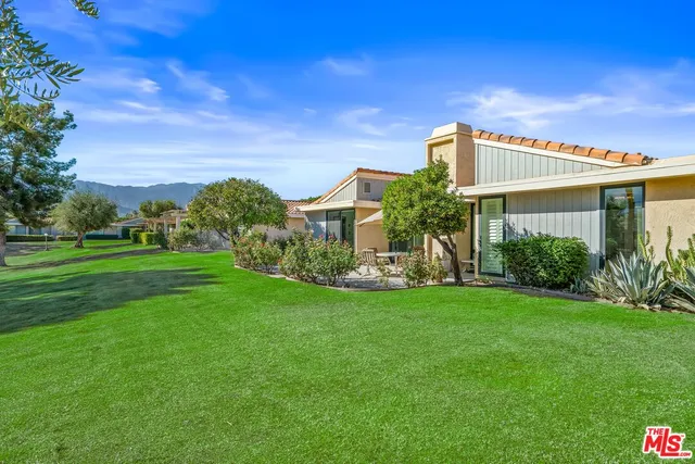 a living room with furniture fireplace and a window
