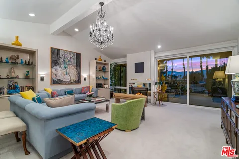 a view of a swimming pool with a table and chairs