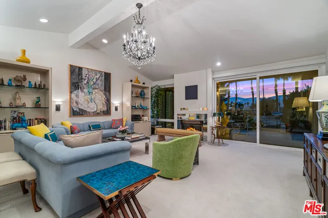 a view of a swimming pool with a table and chairs